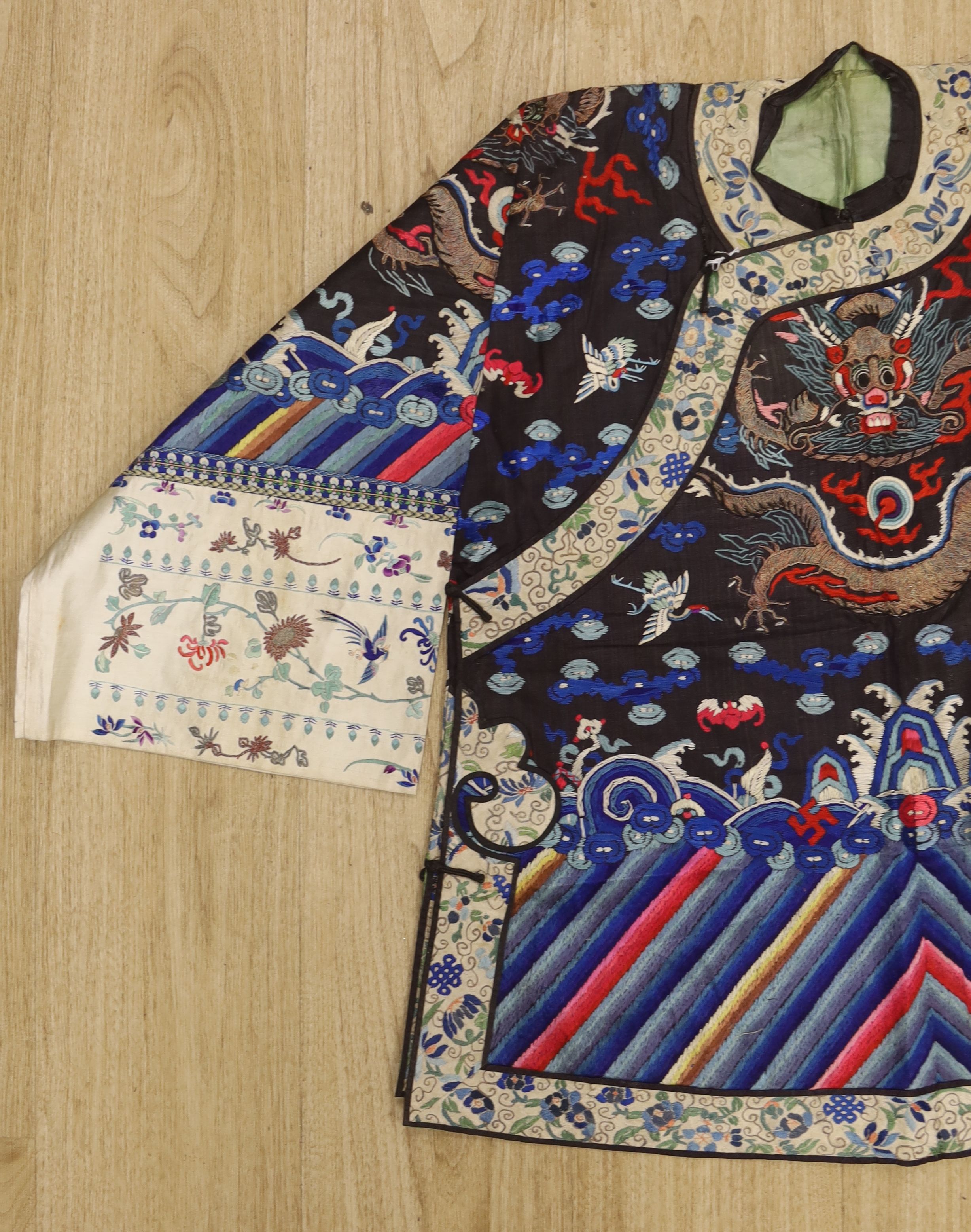 An early 20th century Chinese dragon embroidered silk robe, length 71cm